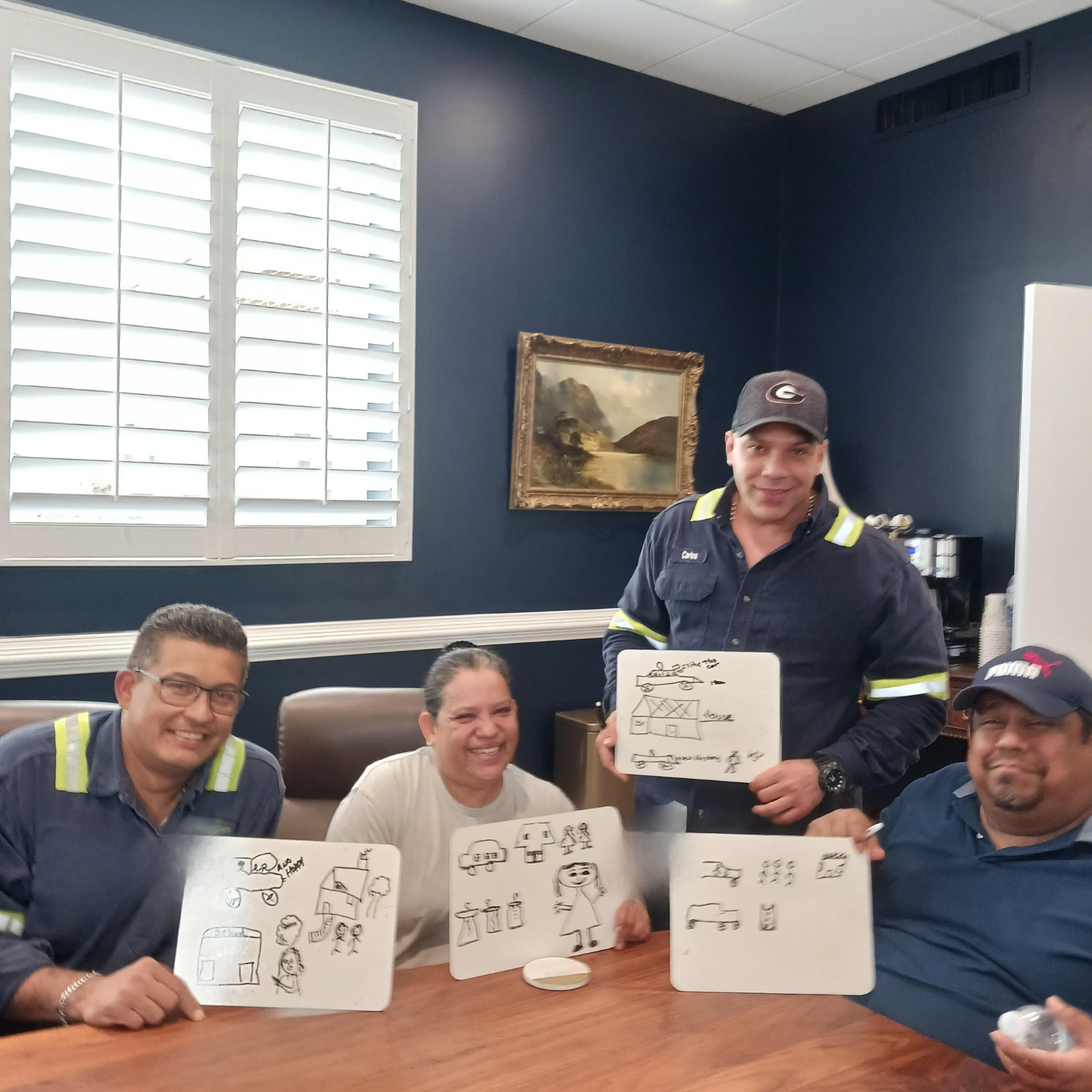 Employees drawing what they understood from a story during class